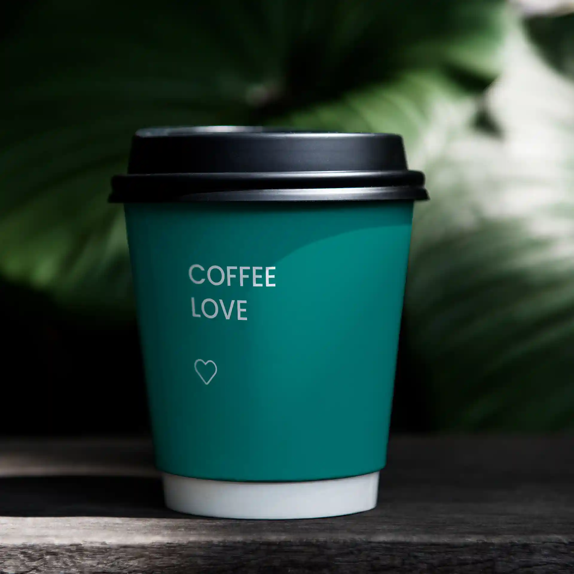 Double-walled teal paper cup with a black lid, featuring the text "COFFEE LOVE" and a heart symbol.