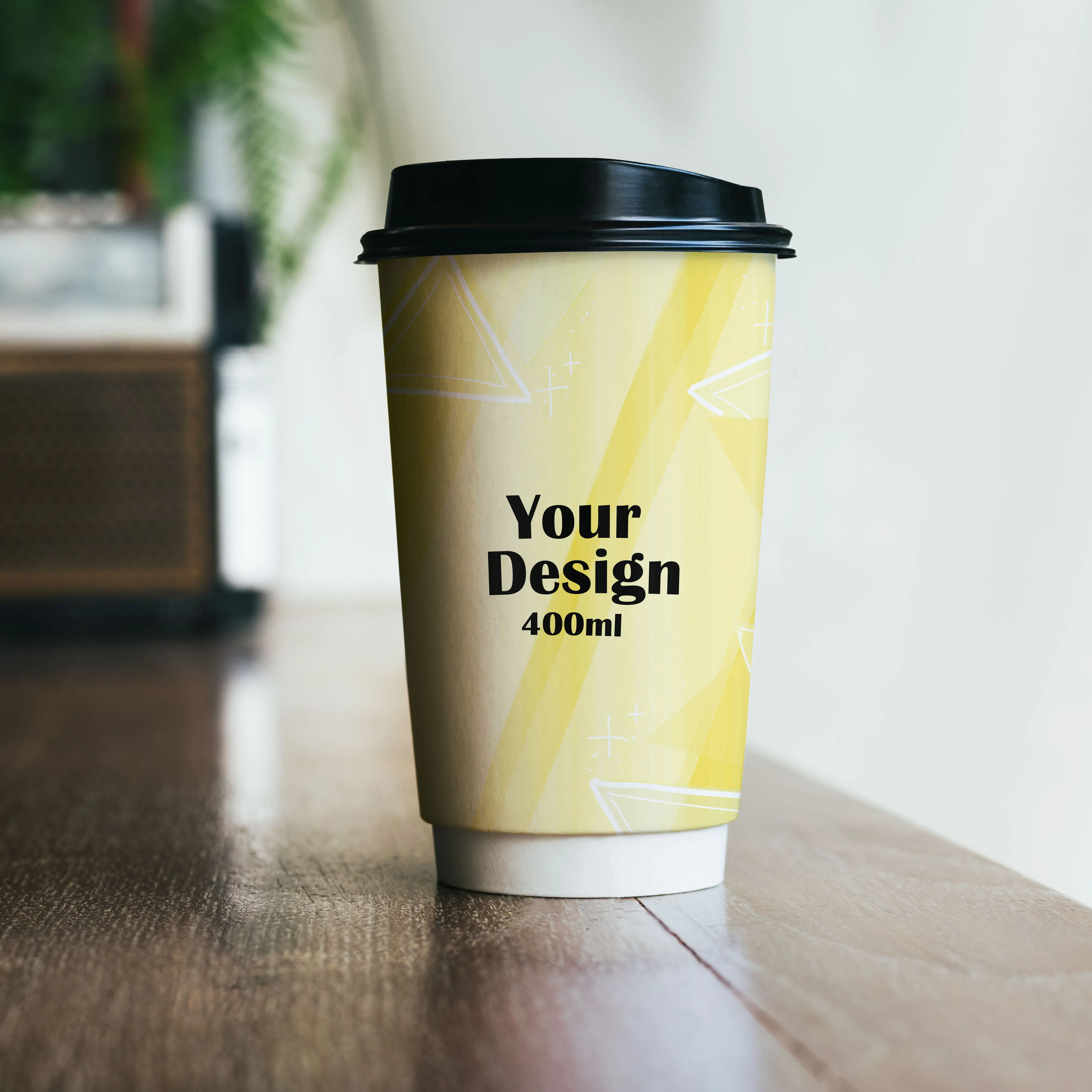 Custom printed double-wall paper cup in yellow design with black lid; features "Your Design" and 400ml capacity.