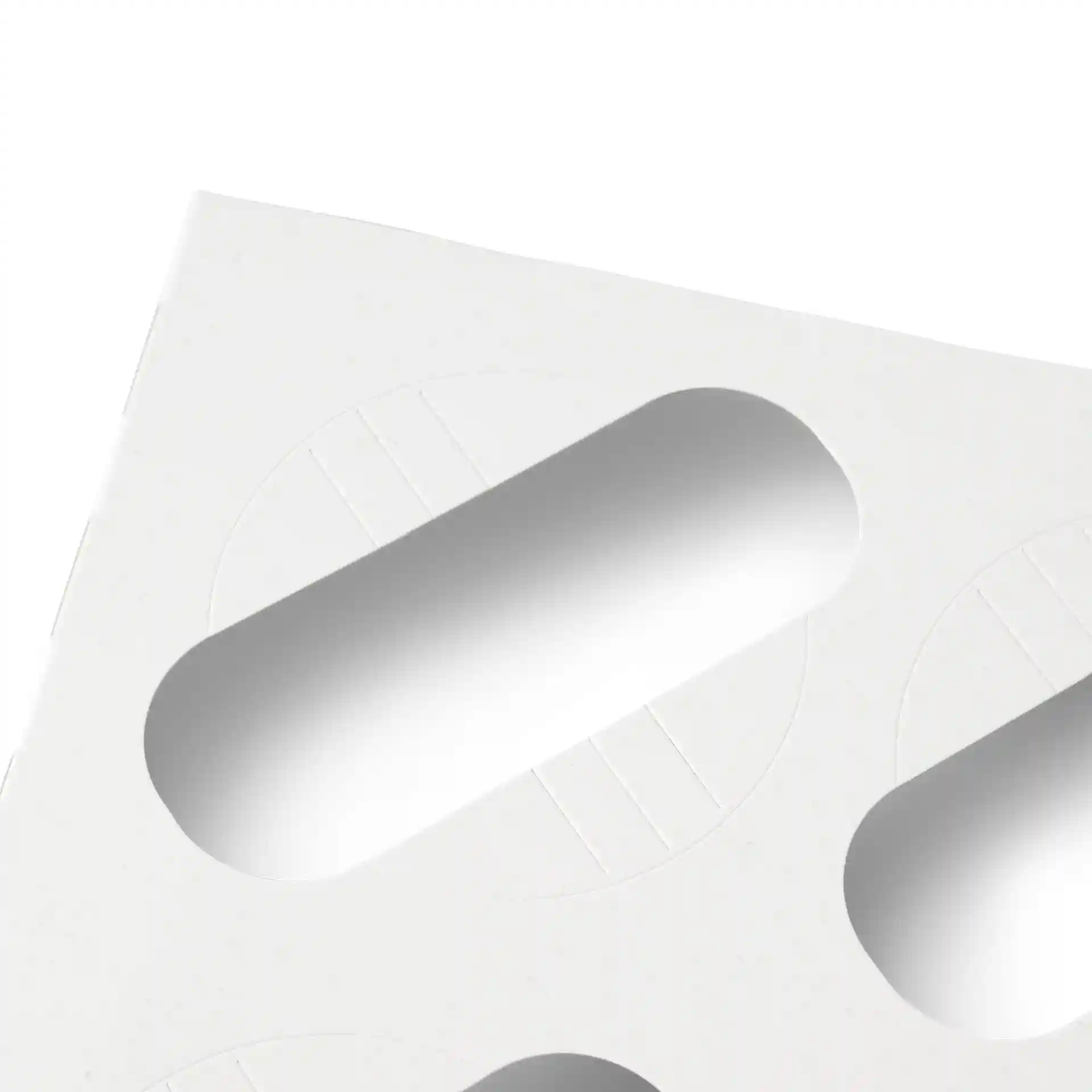 White cardboard insert with oval cutouts for holding cupcakes, designed for use in cupcake boxes.