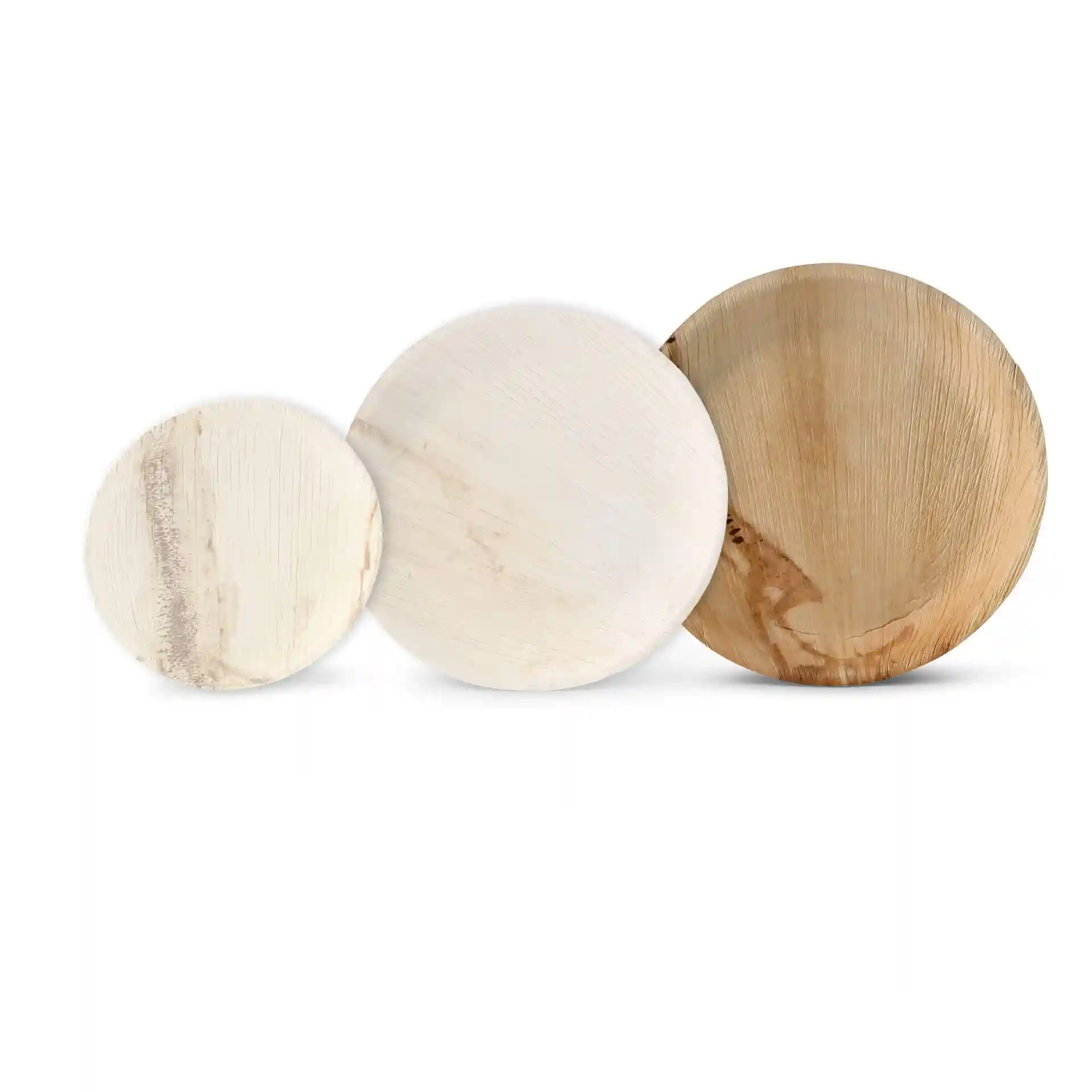 Three round palm leaf plates in varying sizes, displaying a natural grain texture.
