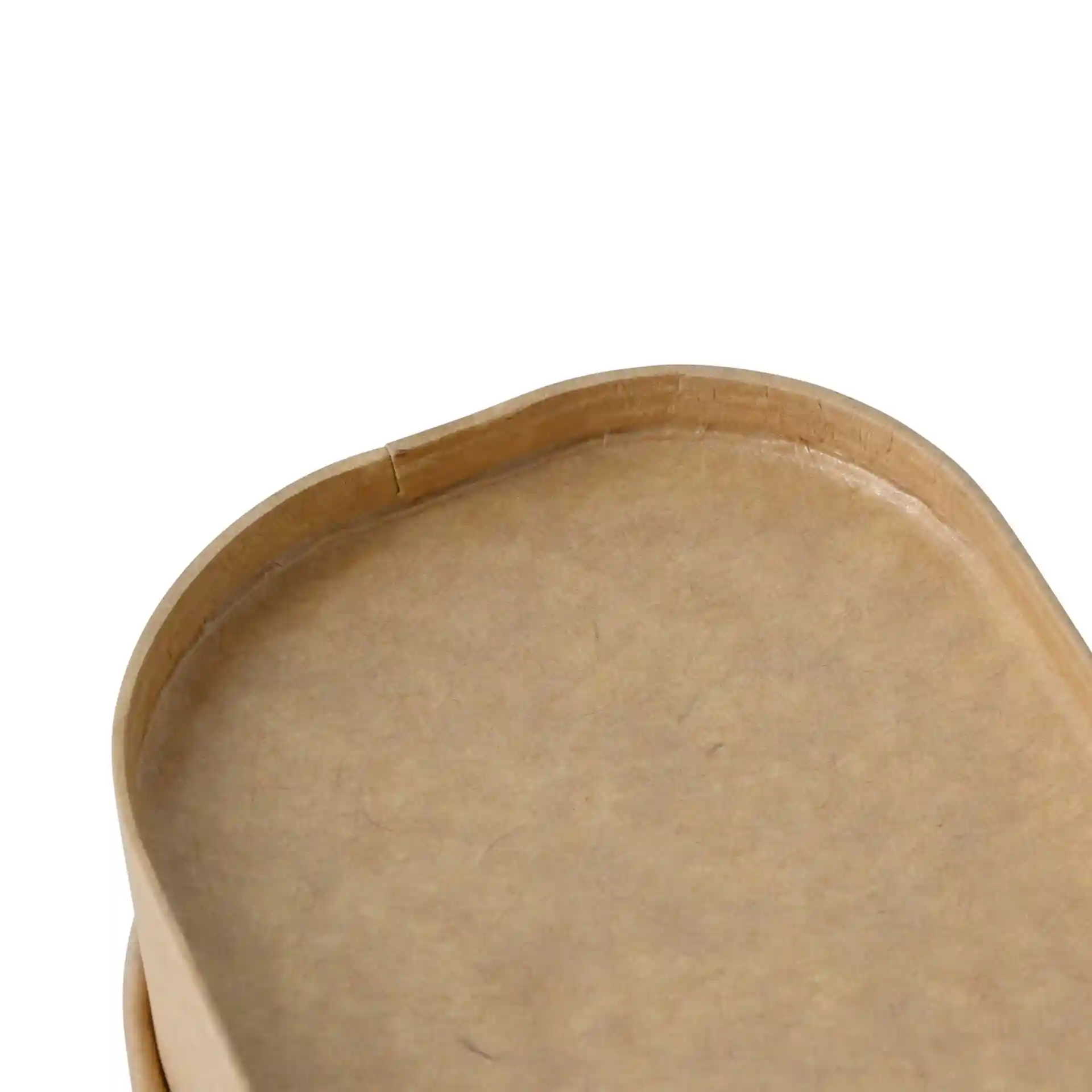 Close-up of a rectangular brown cardboard food container with a smooth edge and a slight seam.
