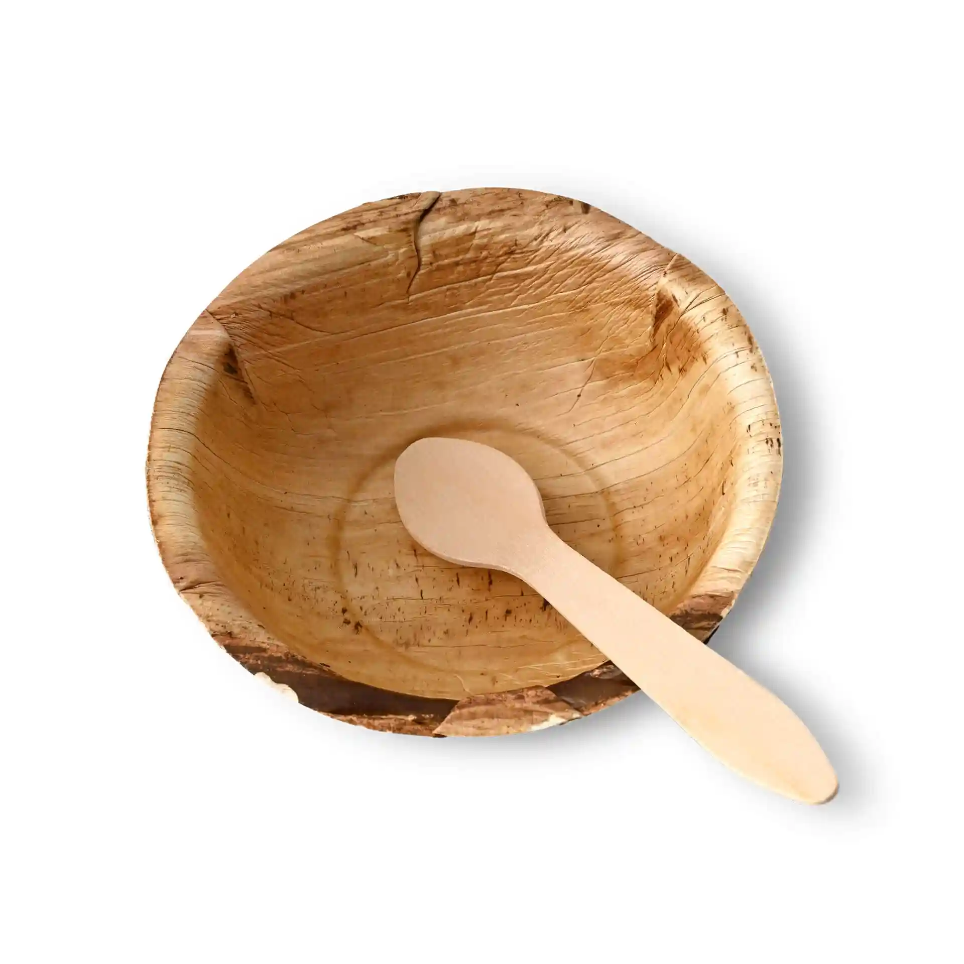 Runde Palmblatt-Schüssel mit einem Holzlöffel darin, zeigt eine natürliche Maserung.