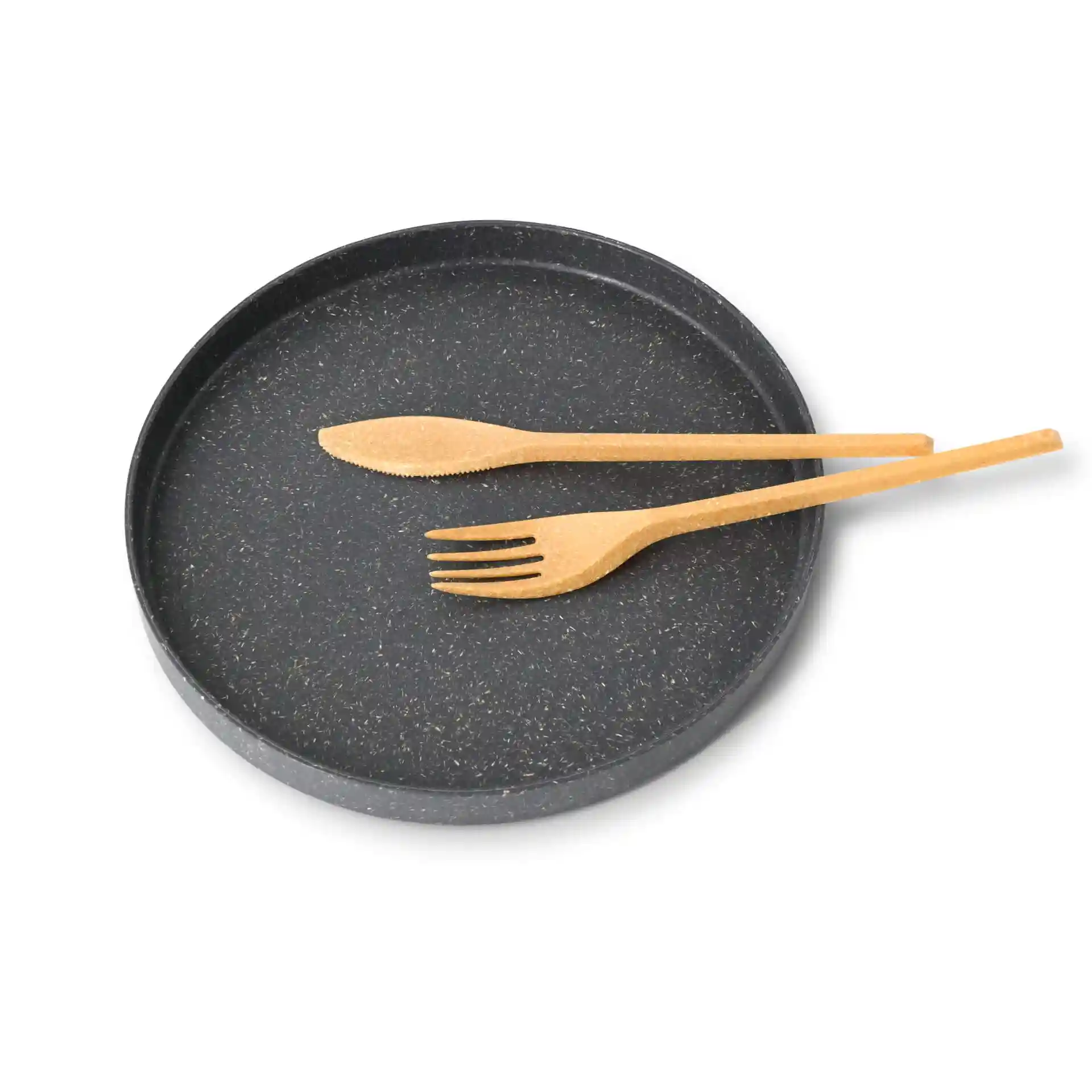 Round black plate with two reusable brown utensils, a knife and a fork, placed on top.