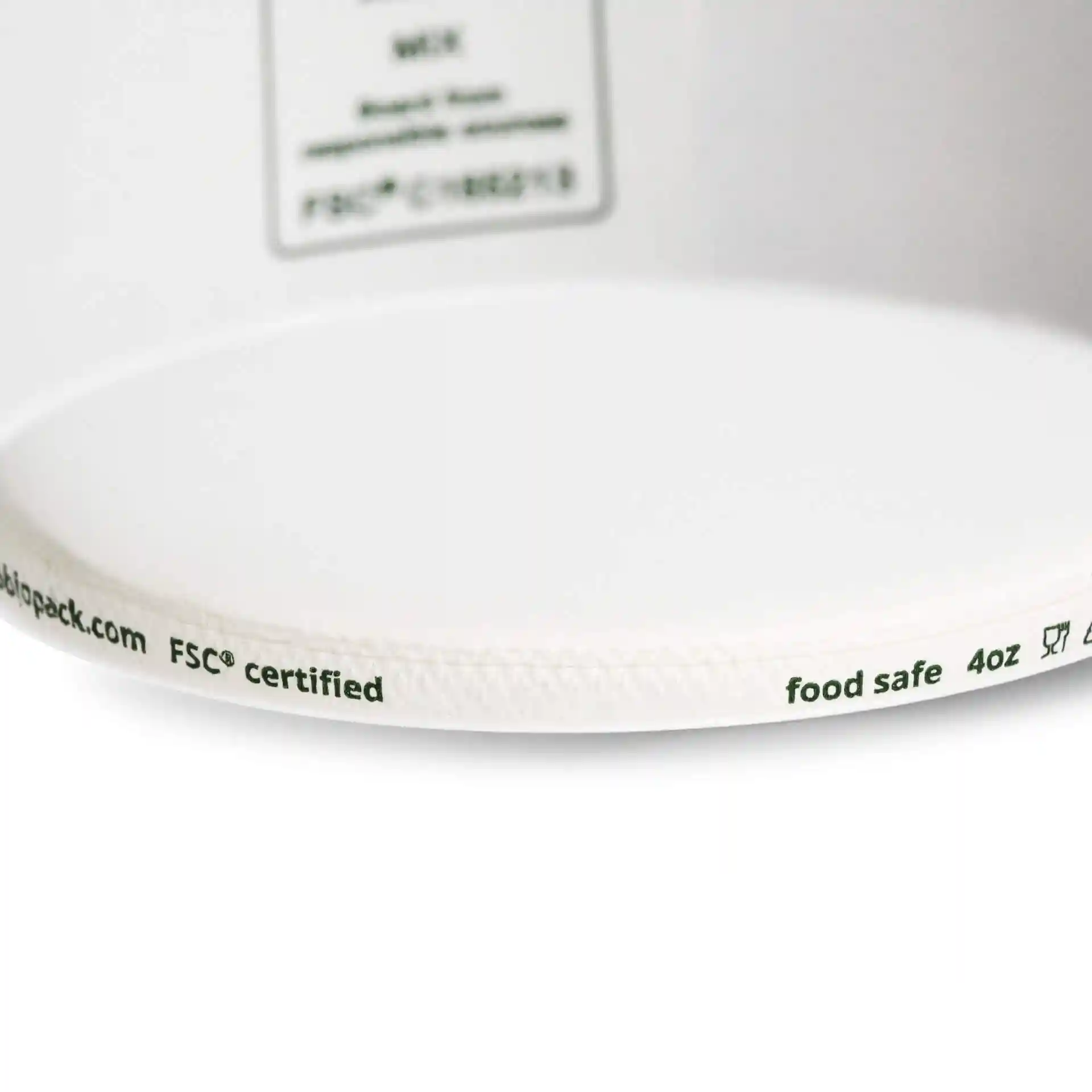 White paper ice cream cup with a diameter of 92 mm and markings on the rim indicating food safety and volume.