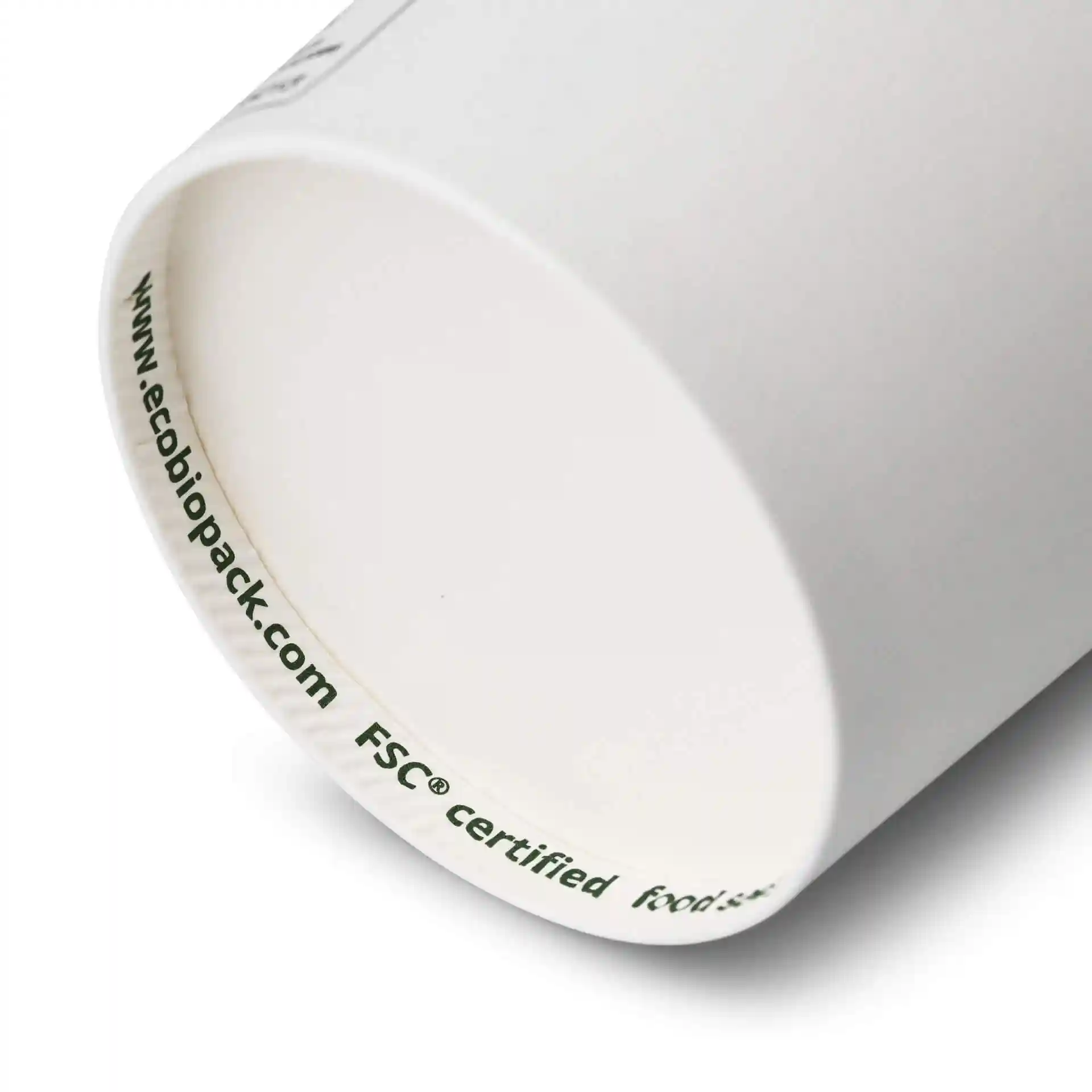 White paper cup with a round shape, showing the inner rim and a printed label with markings.