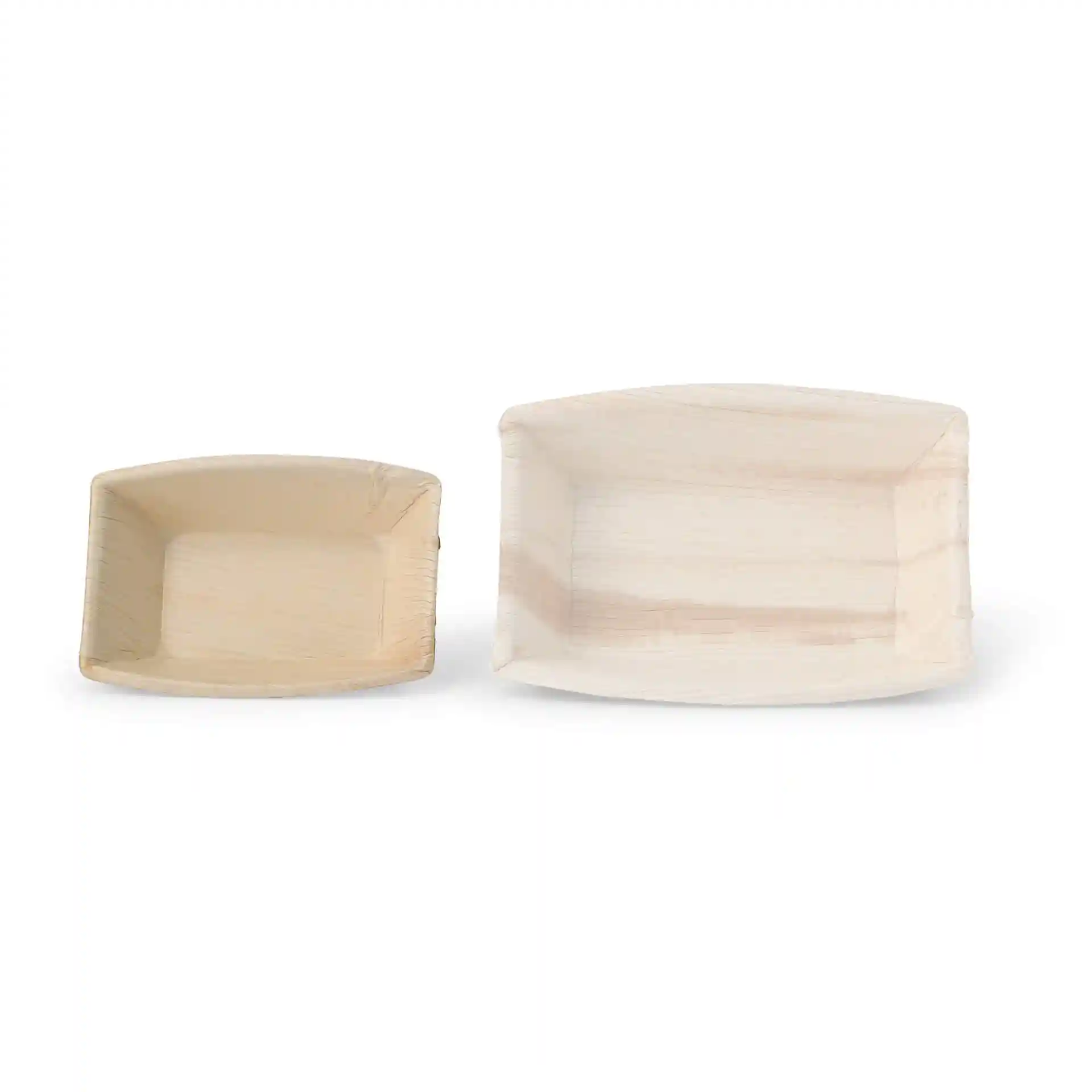 Rectangular palm leaf bowls in two sizes, one larger and one smaller, with a natural grain color.
