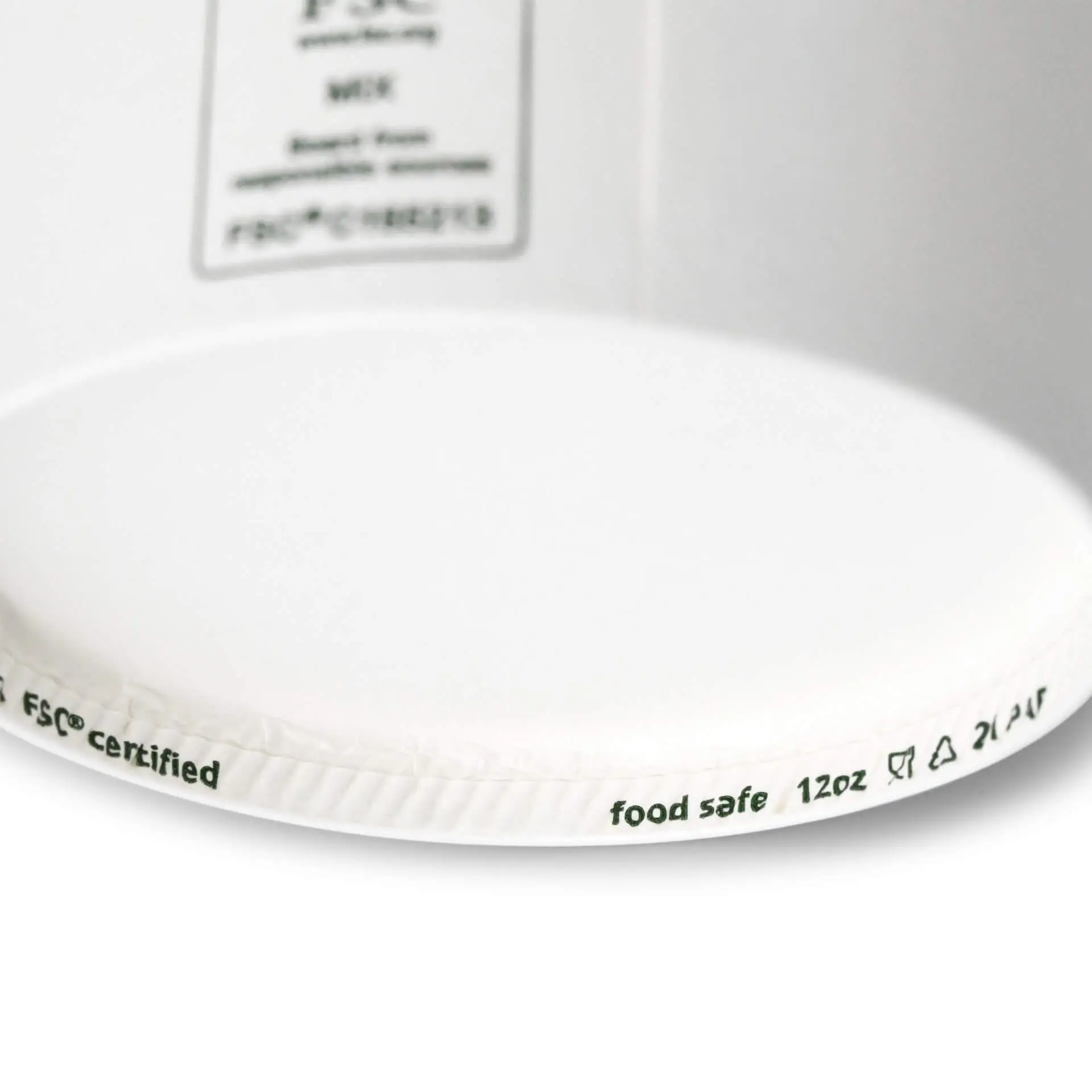 One white paper ice cream cup with markings for 12 oz capacity and "home compostable" label on the rim.