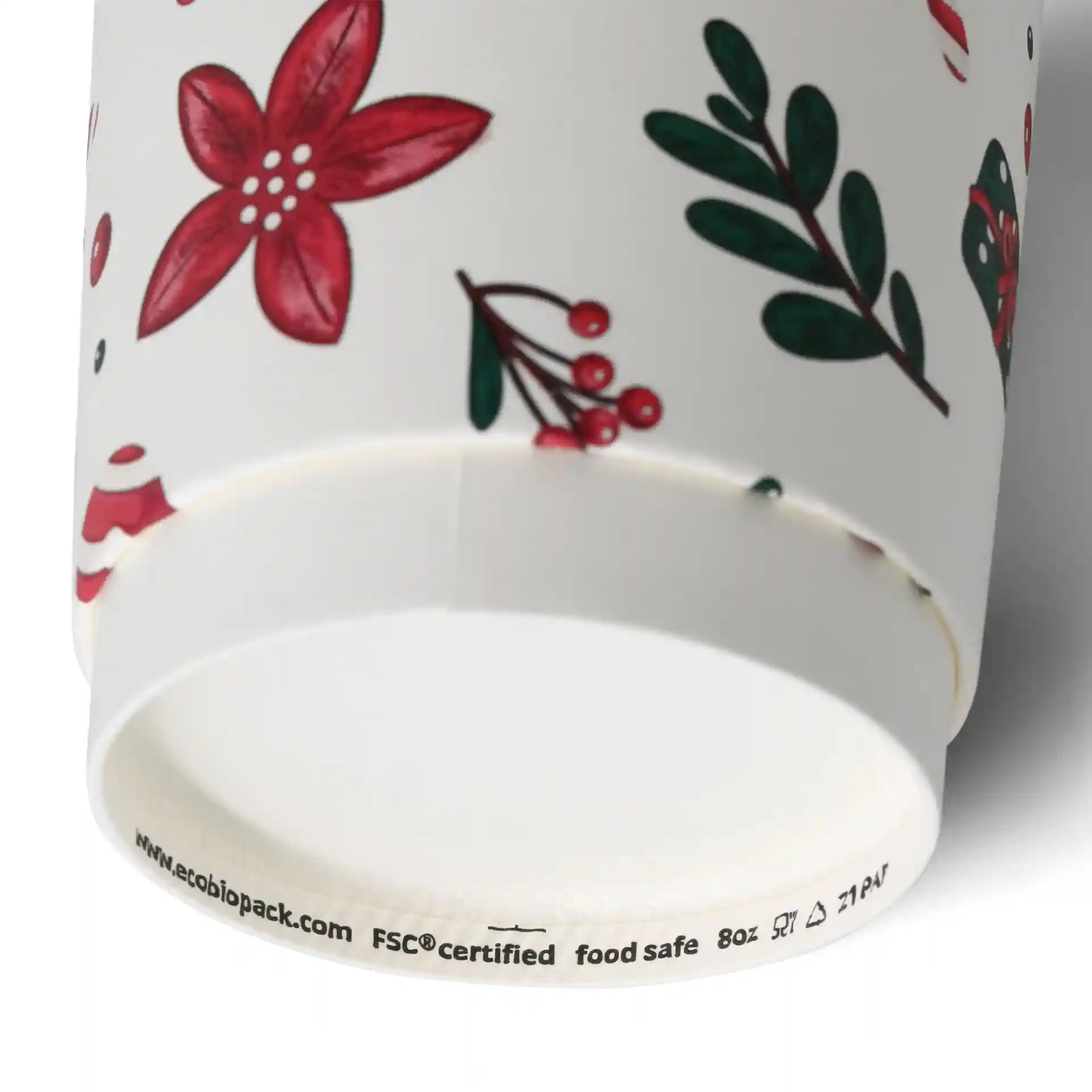 Double-wall coffee cup with a winter design featuring red flowers and green leaves, 8 oz capacity.