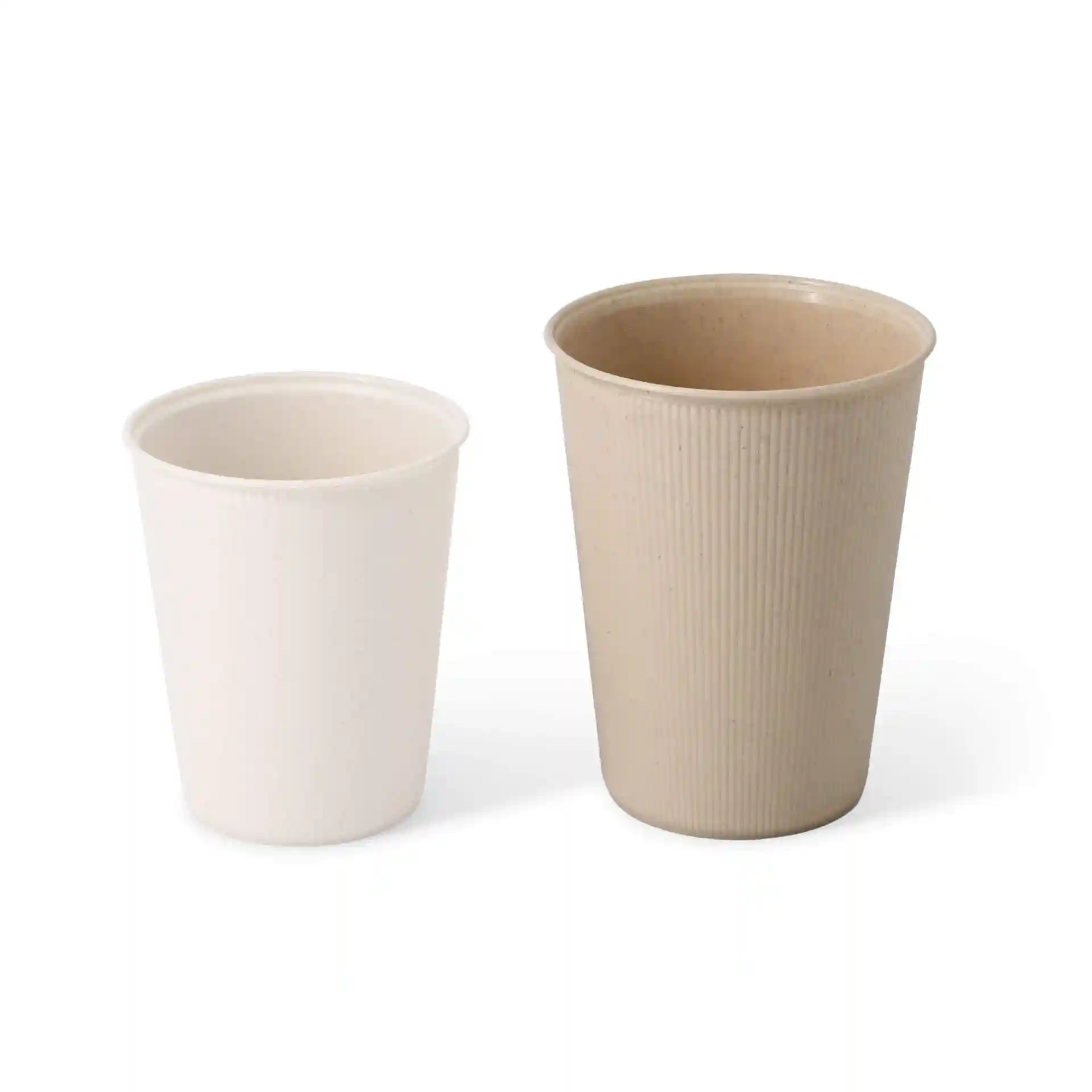 Two ribbed cups, one cream white and one beige, displayed side by side on a plain background.