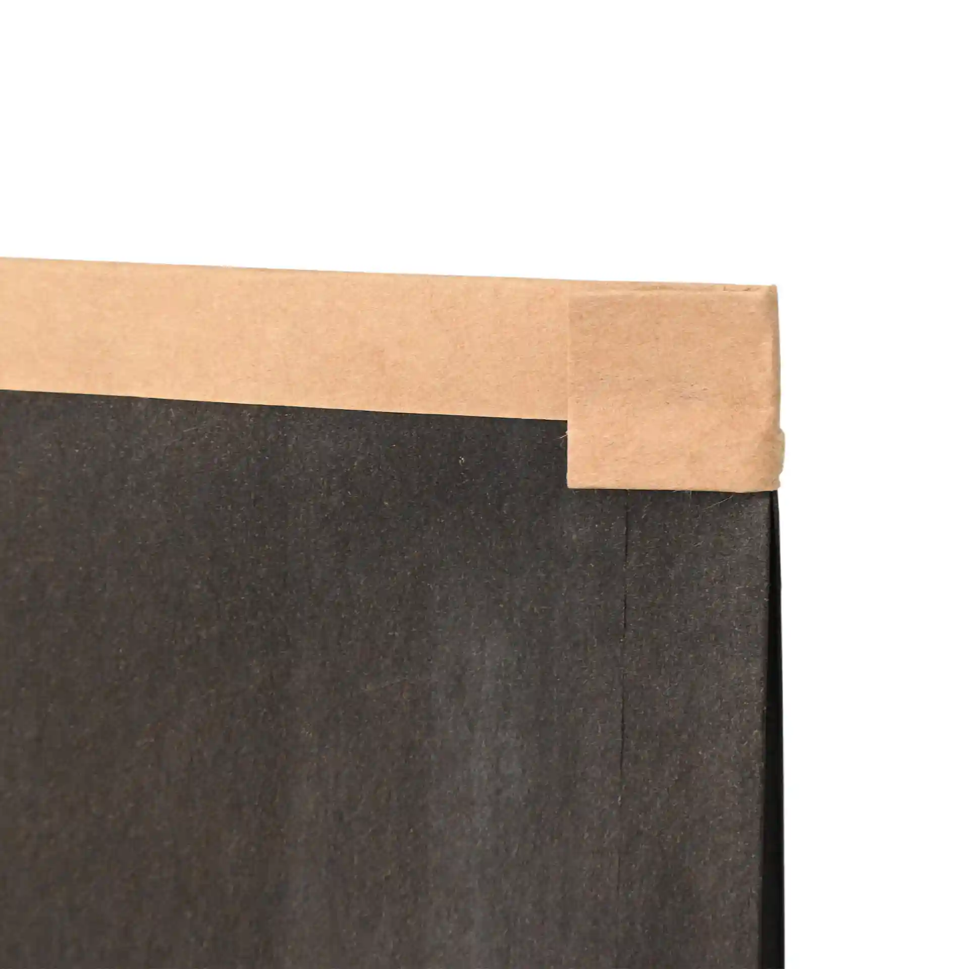 Close-up of a black block bottom bag with a kraft paper tin tie at the top edge.