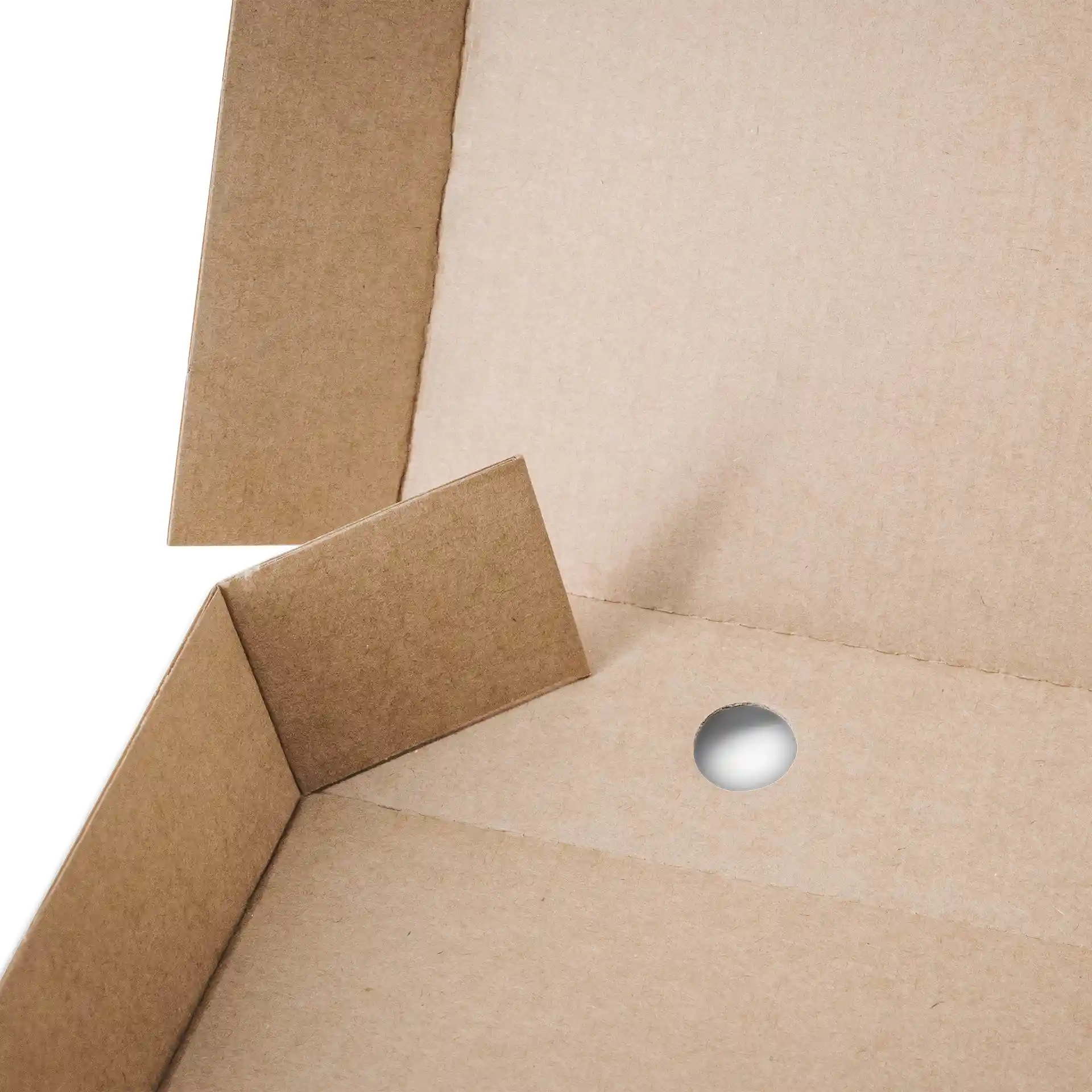 Interior view of a brown cardboard pizza box with a circular hole and folded corners.