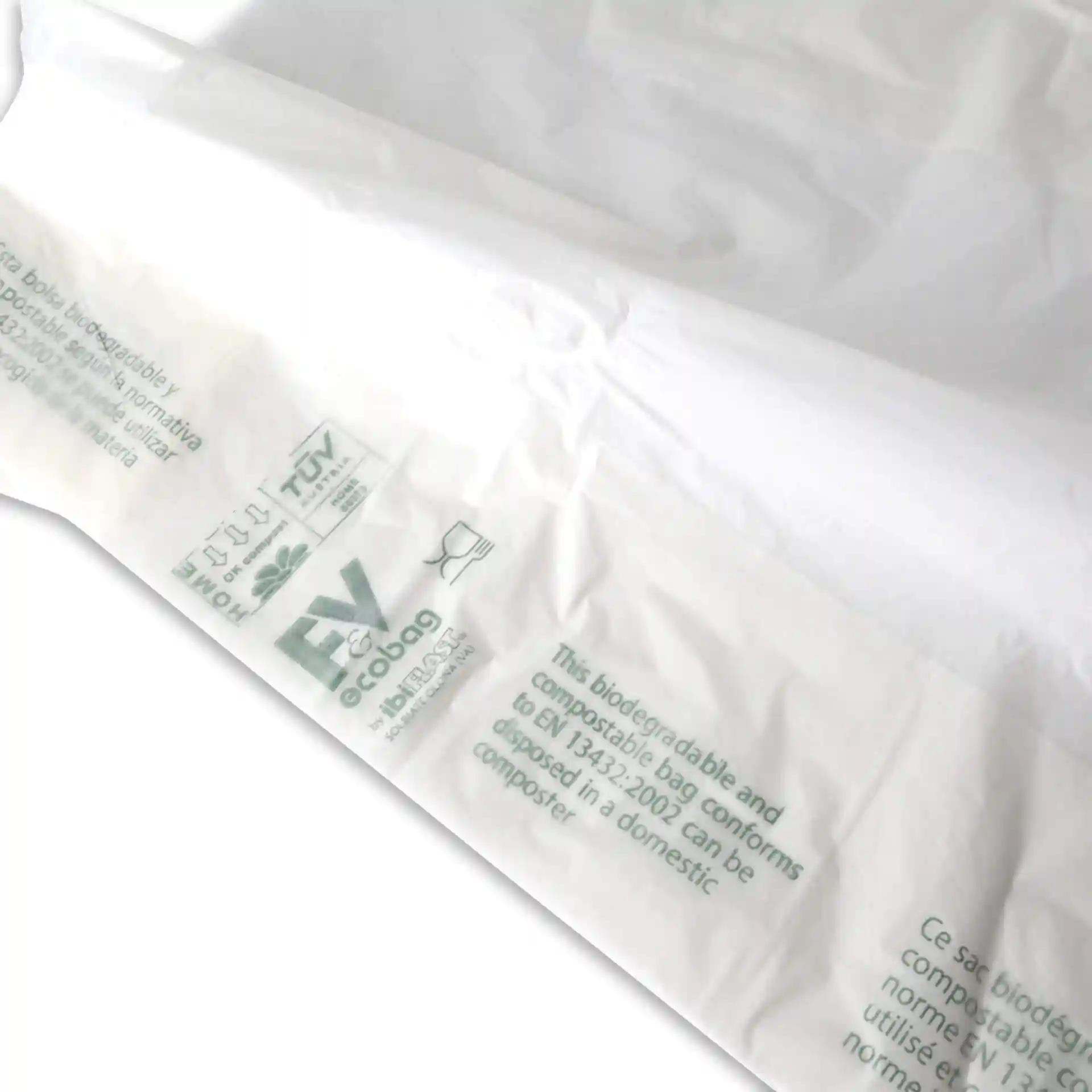 White biodegradable bag with printed markings, measuring 22 x 13 x 50 cm, shown partially open.