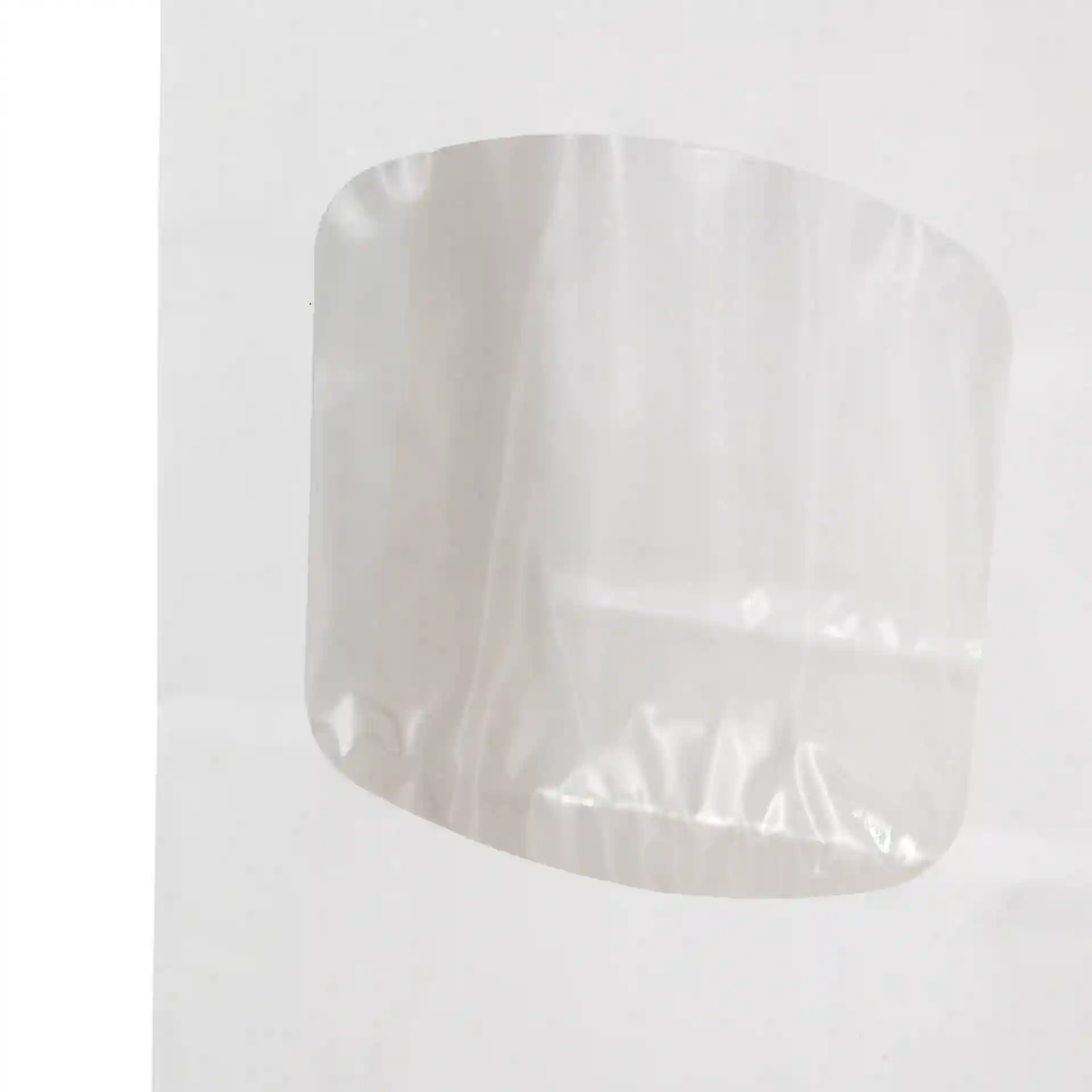 White block bottom bag with a transparent viewing window, measuring 9 x 4.5 x 26 cm, made of PP-foil.