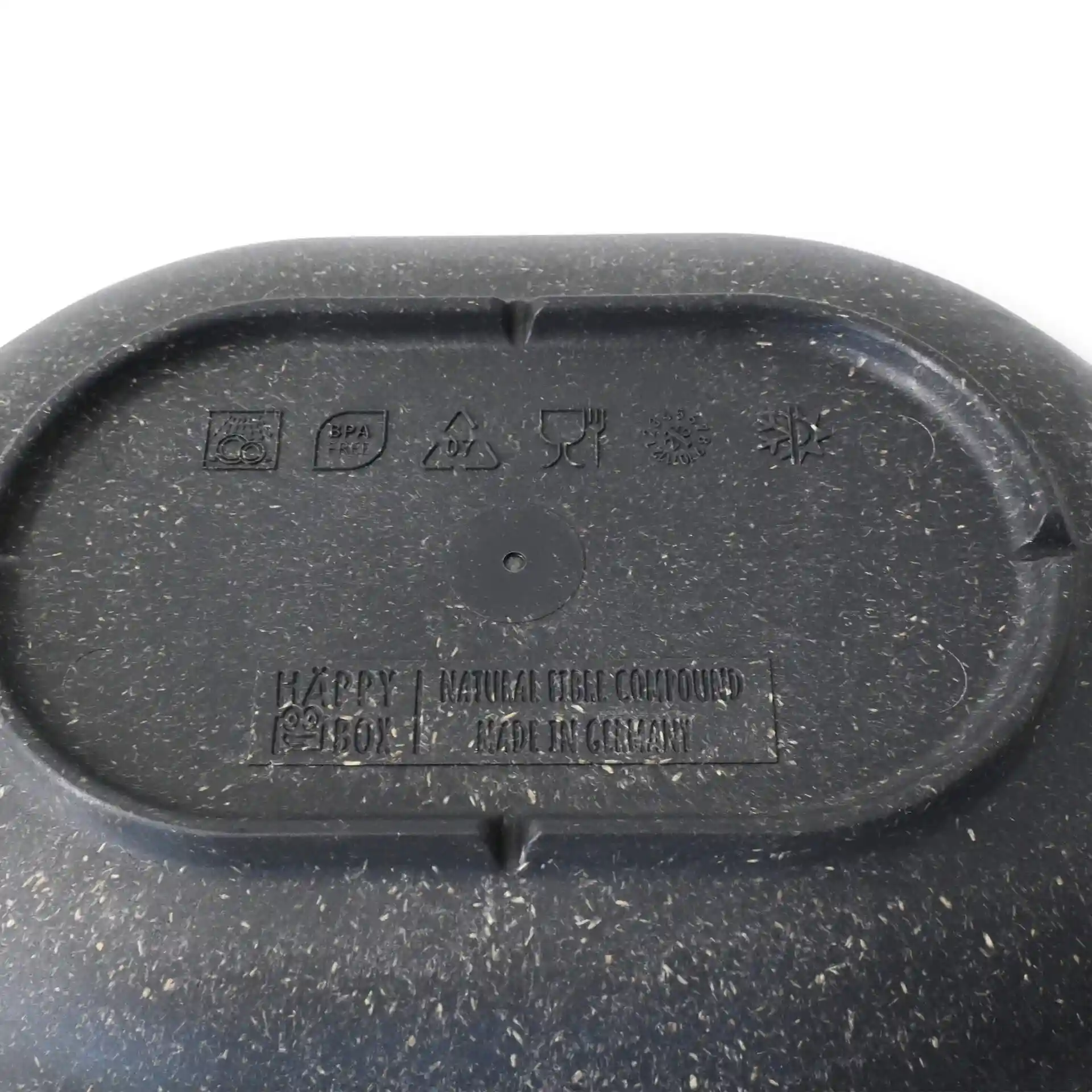 Oval grey reusable snack bowl with a textured surface and various symbols on the bottom.