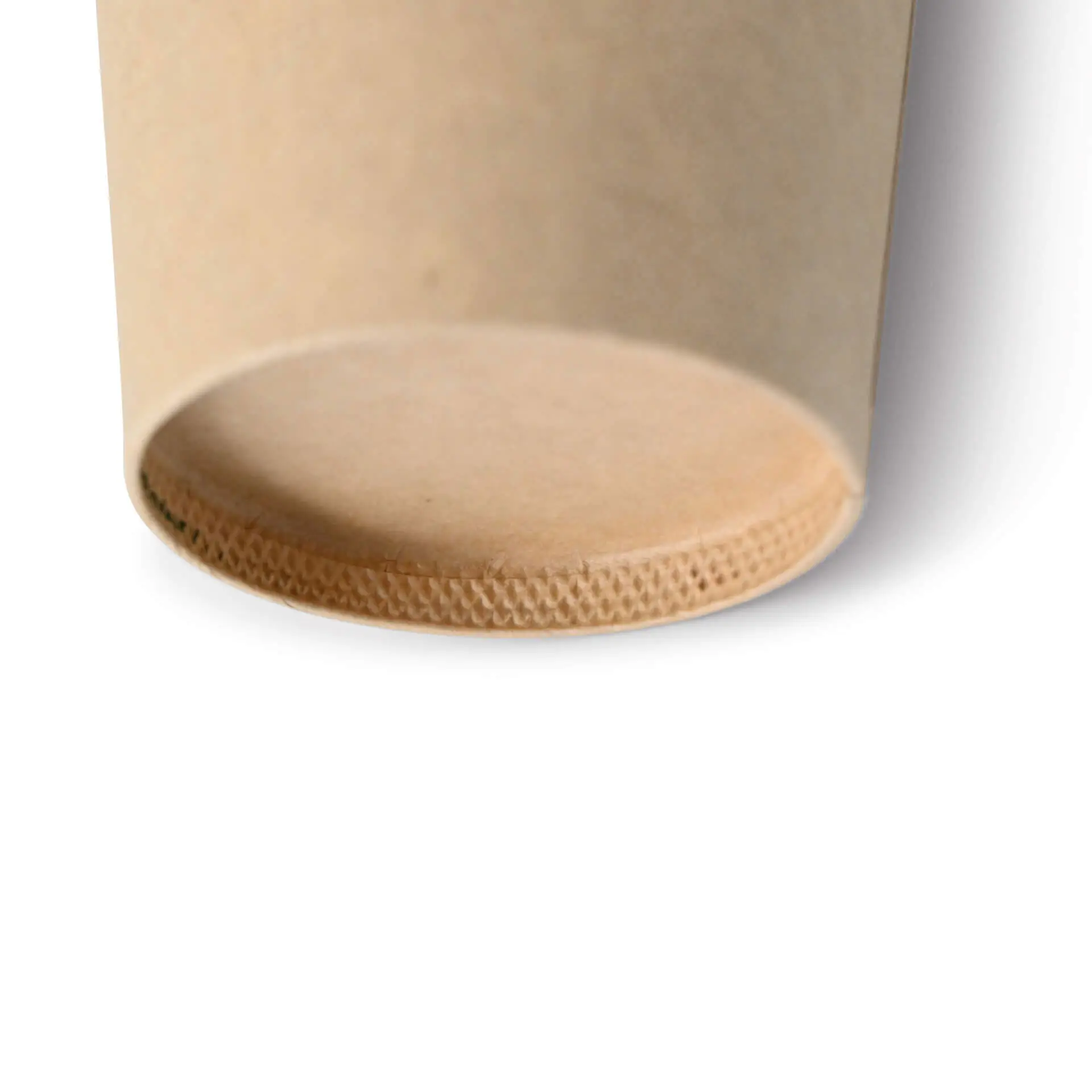 Close-up of the base of a brown paper cup with a PE coating and a textured bottom edge.