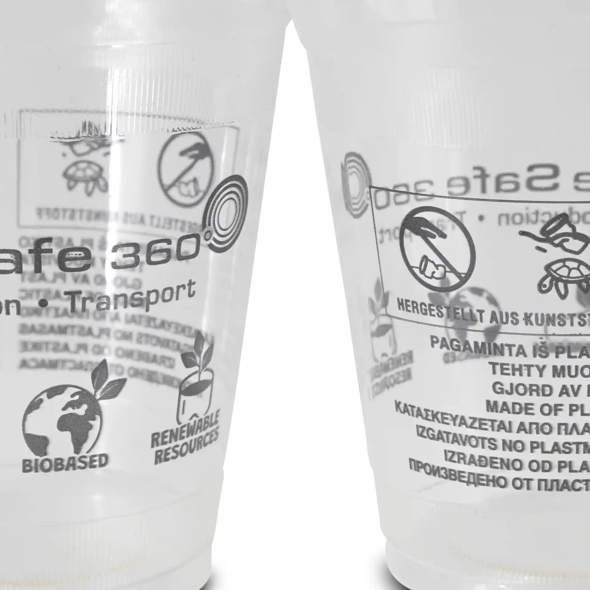 Transparent 12 oz PLA smoothie cups with printed symbols and labels, showing various markings and designs.