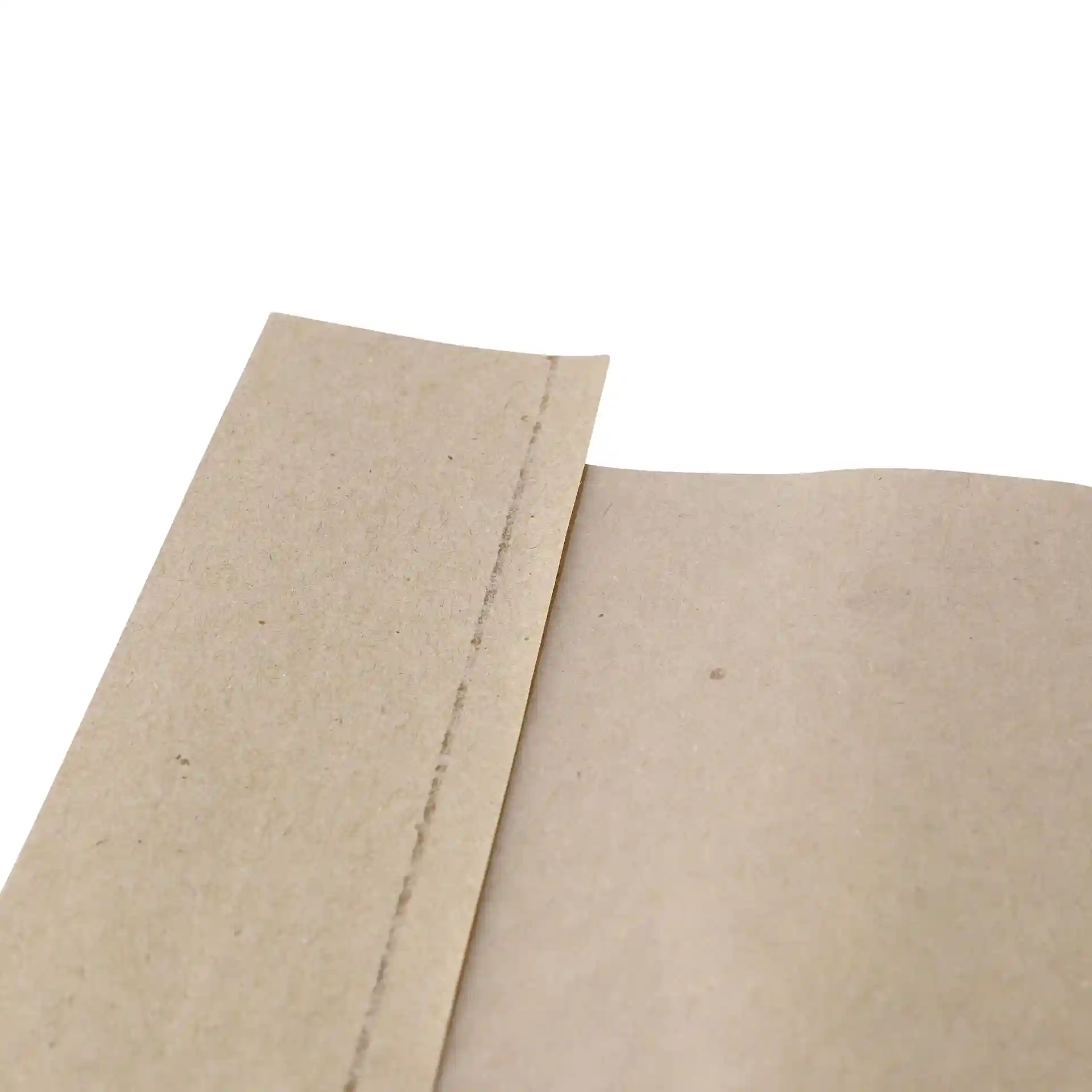 Close-up of a brown flat paper bread bag with a window, showing the edge and surface texture.