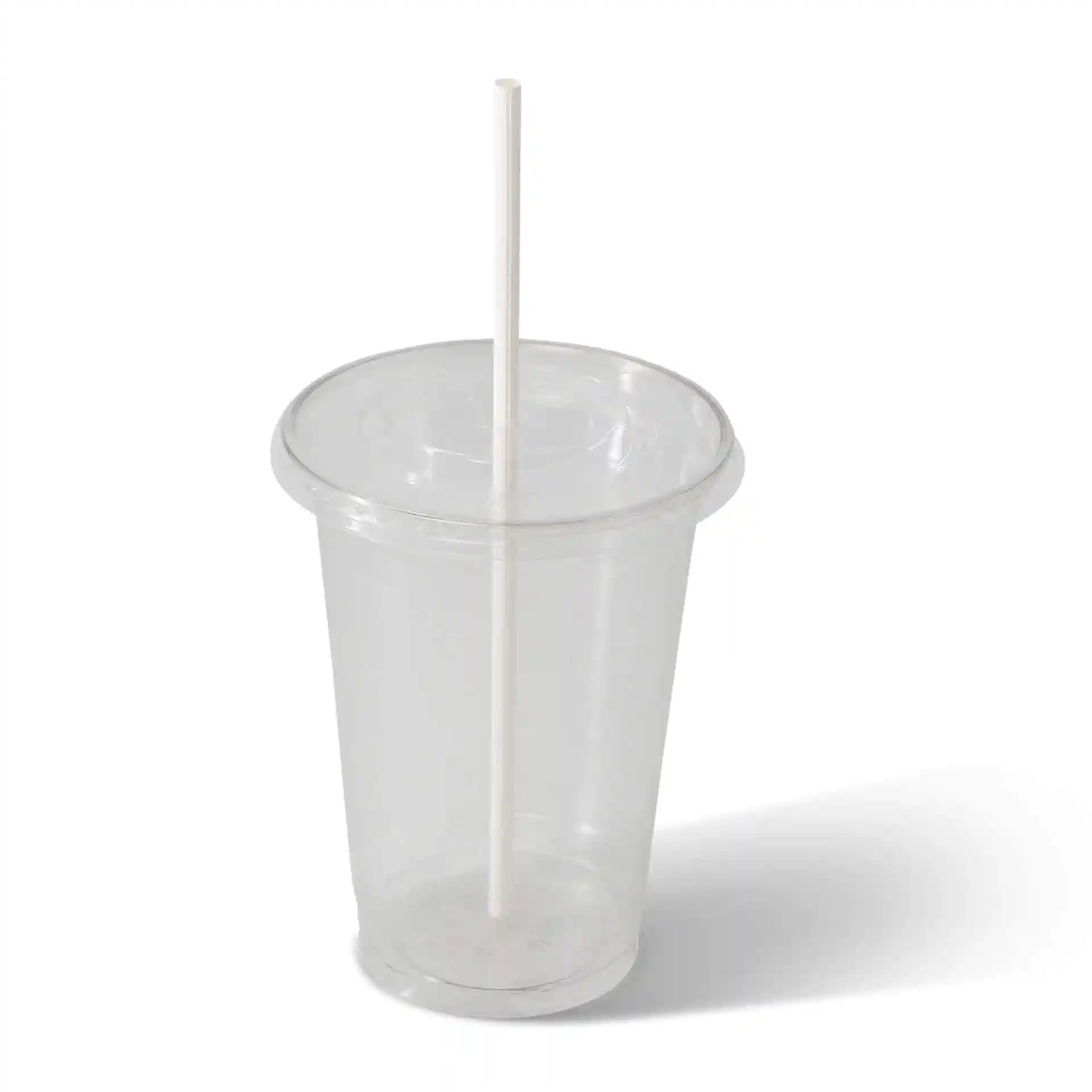 Clear plastic cup with a white paper straw inserted, on a plain background.