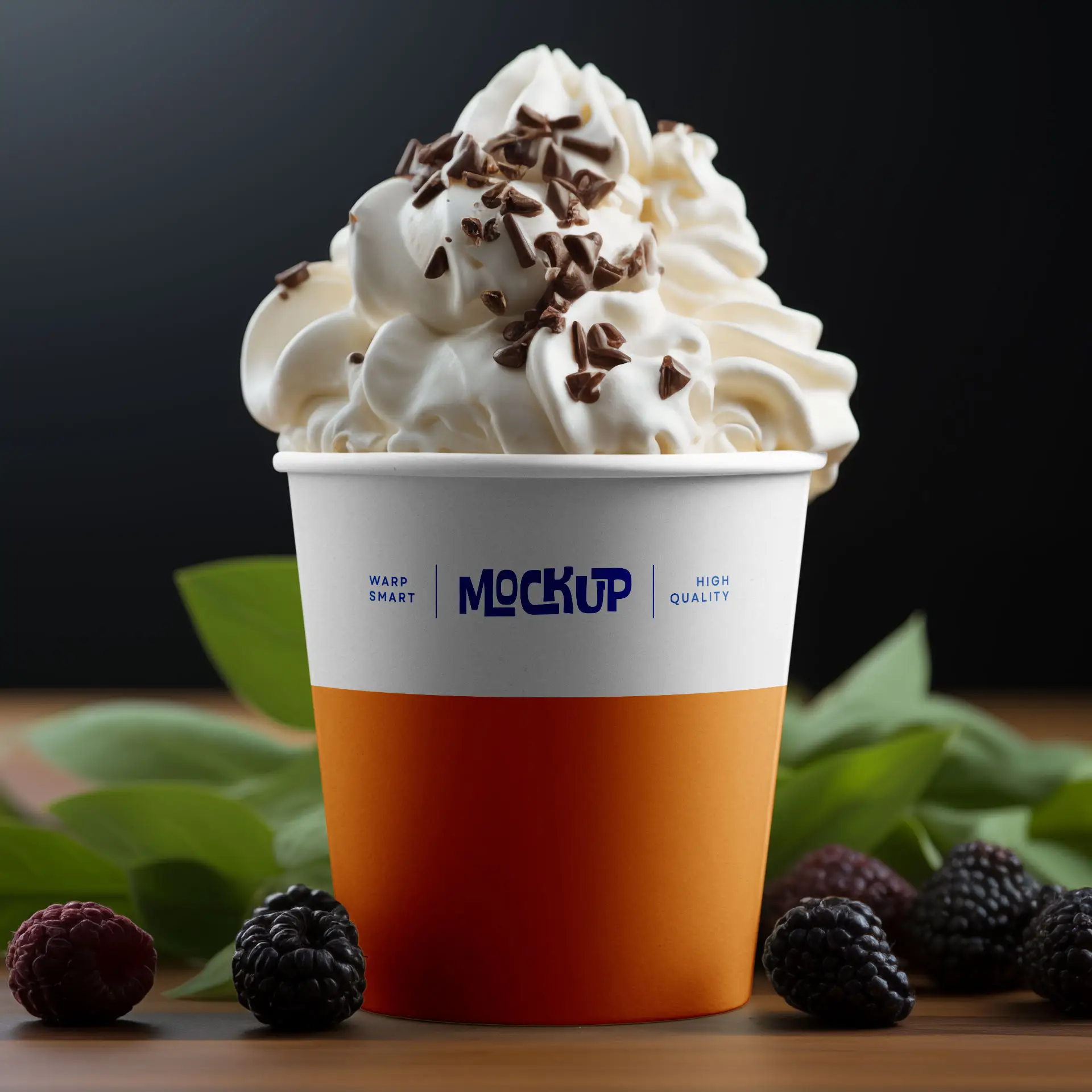 Ice cream cup filled with whipped cream and chocolate shavings, surrounded by berries and green leaves.