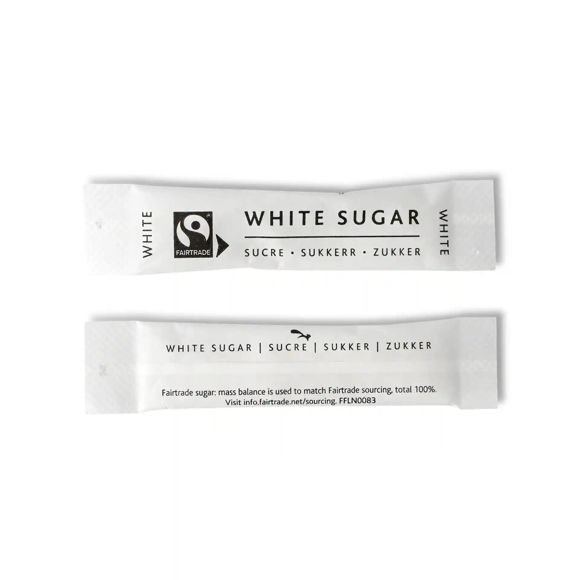 White sugar stick with Fairtrade logo, measuring 74 mm by 16 mm, featuring text in multiple languages.