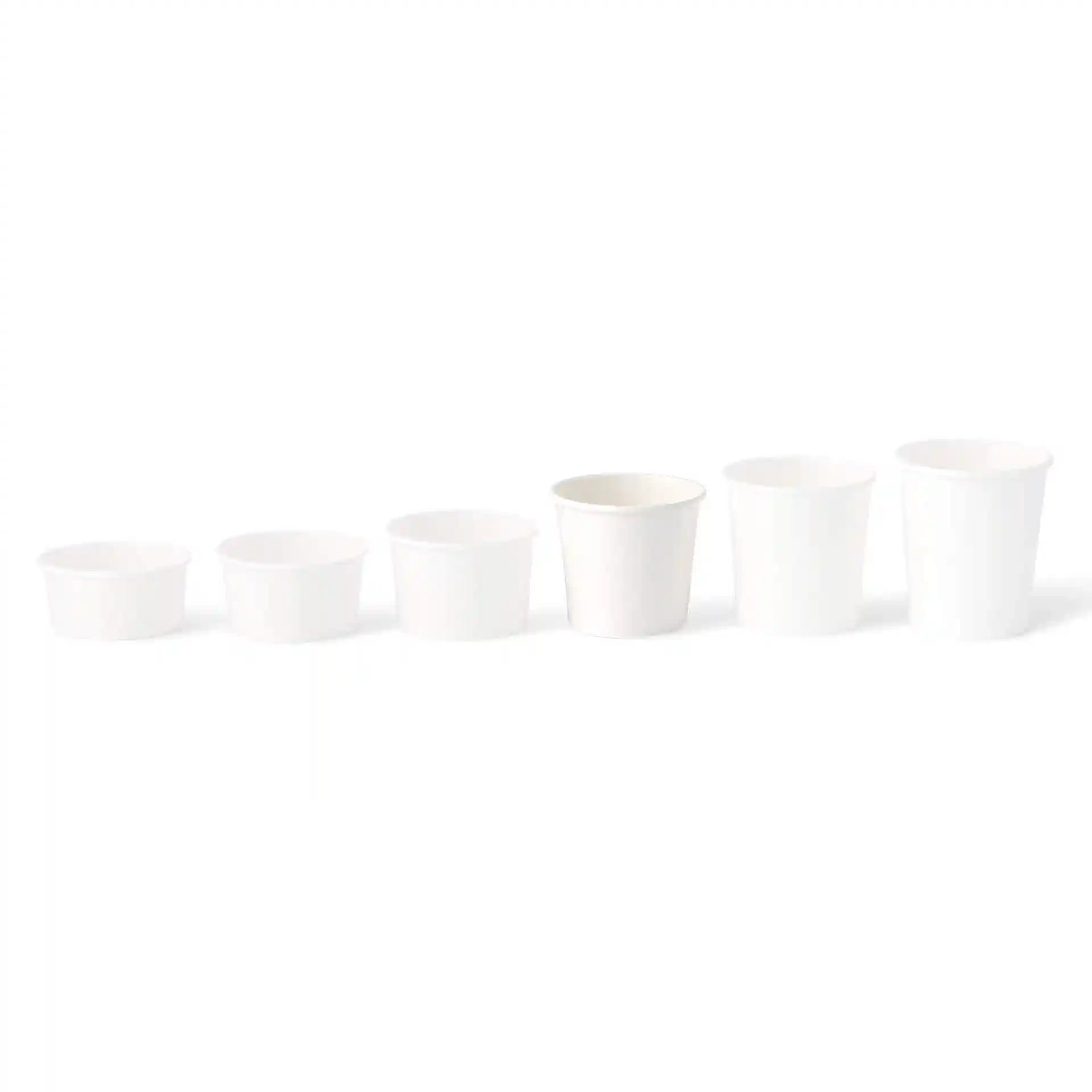 Set of six white paper ice cream tubs in varying sizes, arranged from smallest to largest.