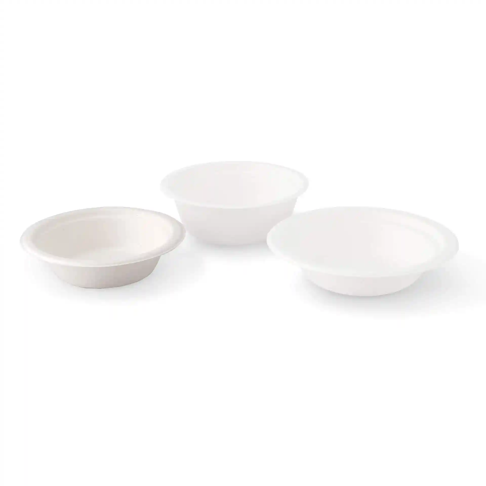 Three round white sugarcane bowls, one with a slightly raised edge, on a plain background.